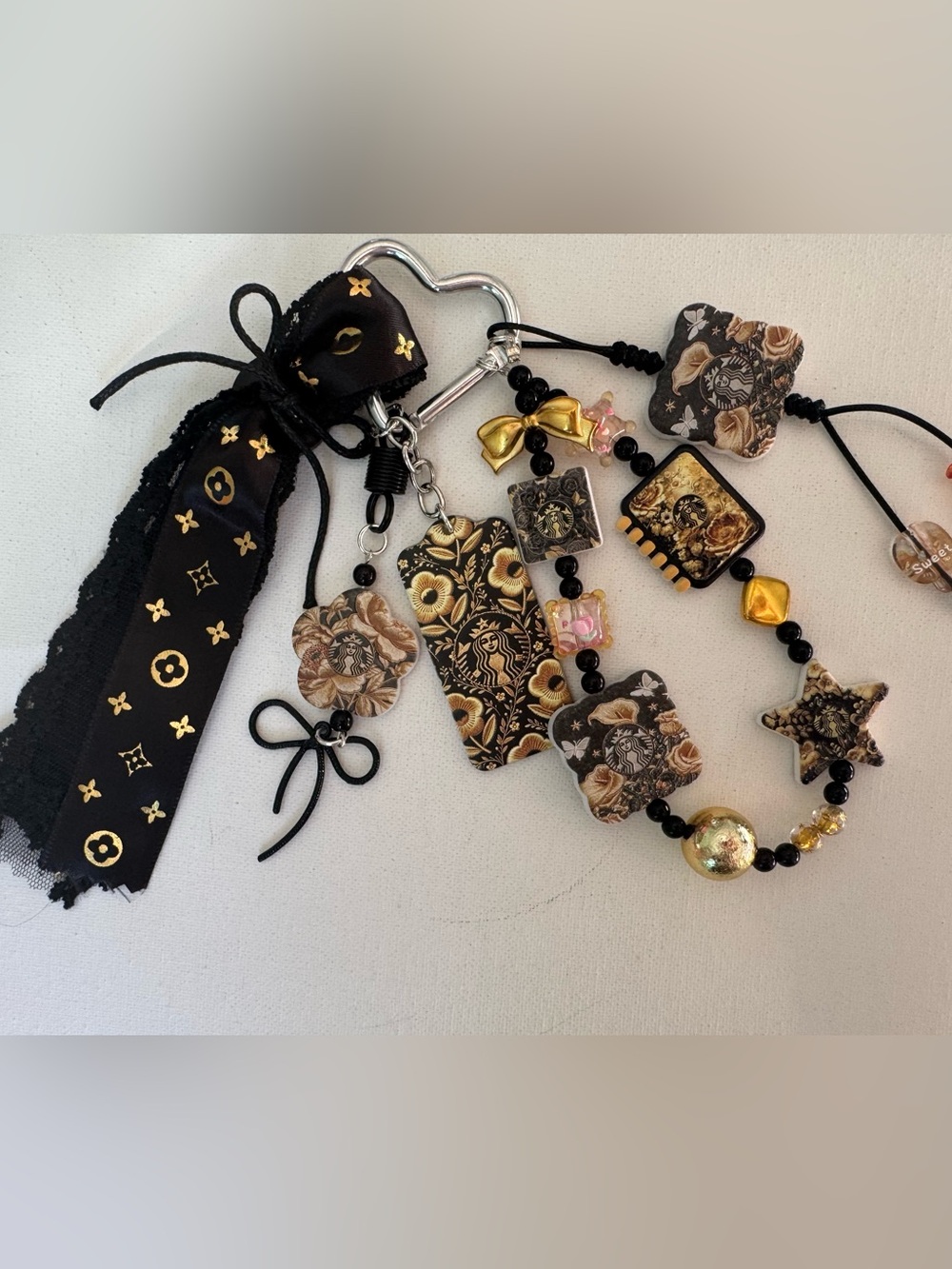 Black and Gold Starbucks Floral Multi-Bag Charm.